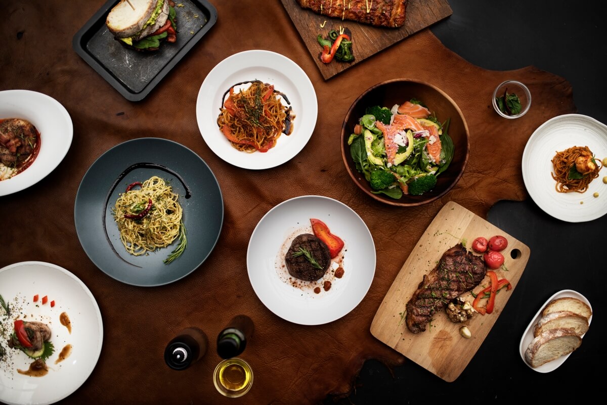 A table filled with different variety of foods served.