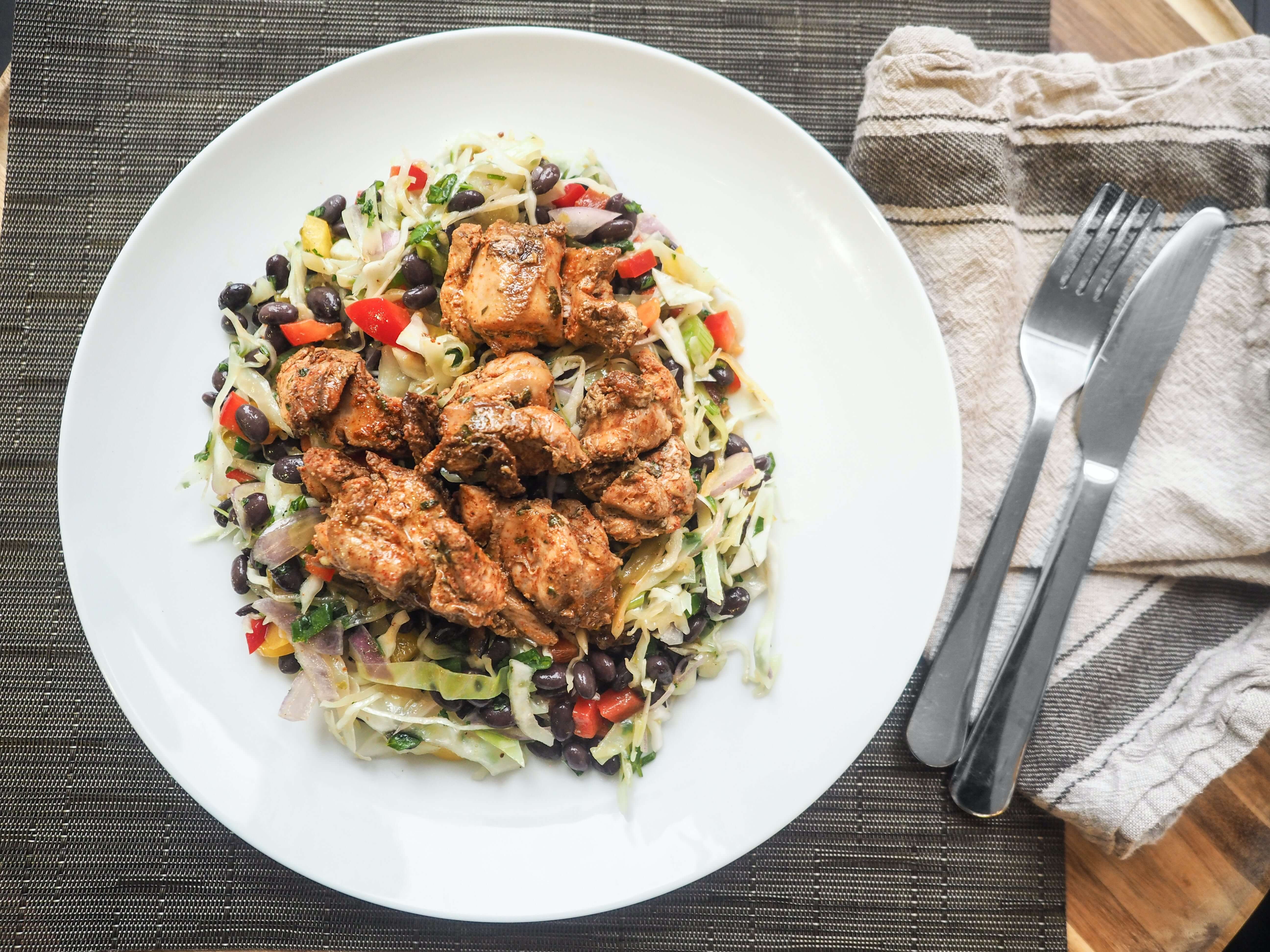 A plate of food with cutlery.